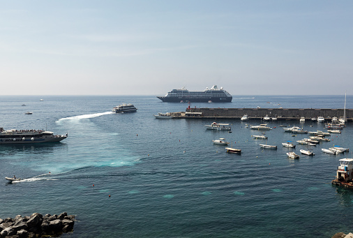 Amalfi, Italy - June 16, 2017: The marina and port at the Italian town of Amalfi in Campania, Italy, a popular destination along the Sorrentine coast.