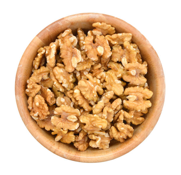walnut in wooden bowl on white - circassian imagens e fotografias de stock