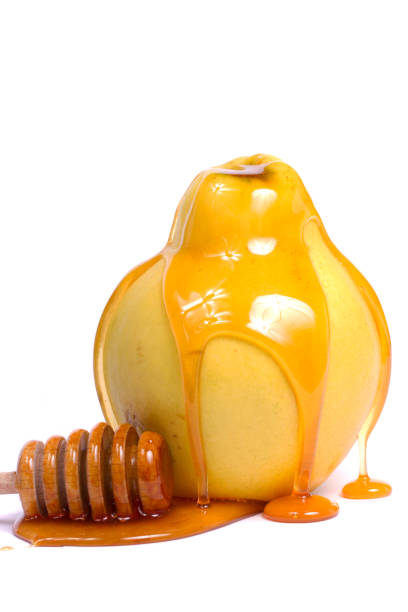 istock quince fruit with a honey dipper 1061732832