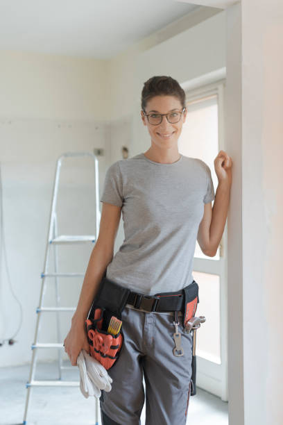 istock Professional female contractor posing with tool belt 1061733670