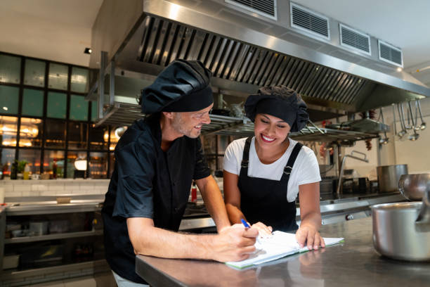 istock Cooks working at a restaurant preparing the menu together 1061735680