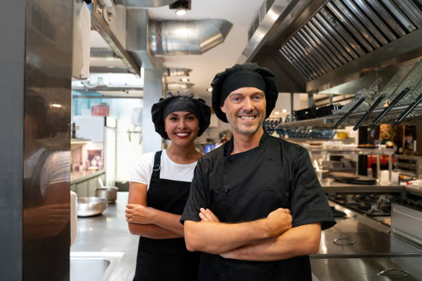 istock Couple of cooks working at a restaurant 1061735688