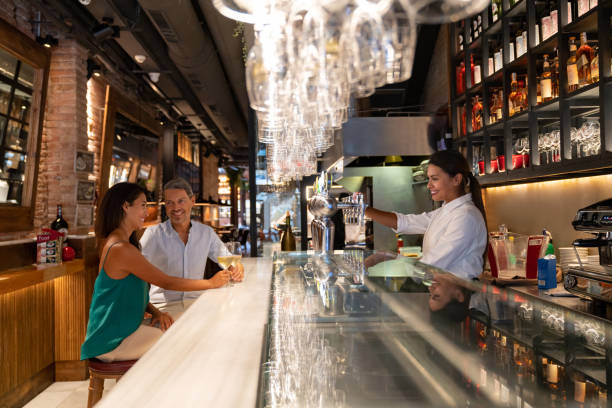 istock Loving couple drinking wine at a bar 1061735990