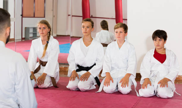 istock Kids taekwondo group ready to practice 1061738518