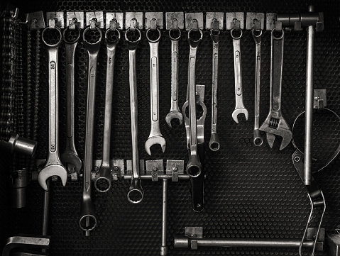 Multiple wrenches hanging on tool board