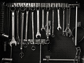 Multiple wrenches hanging on tool board