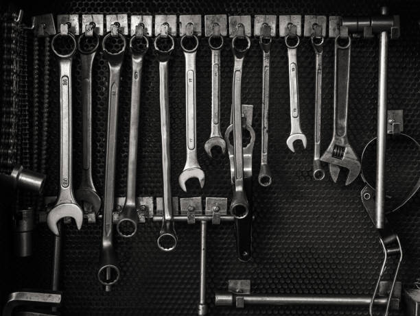 multiple wrenches hanging on tool board - mechanic tools imagens e fotografias de stock