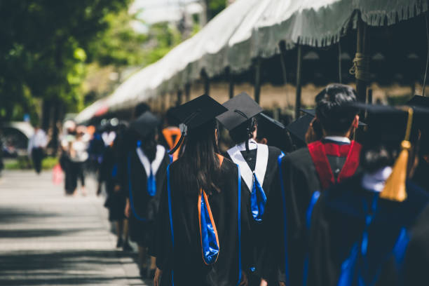 istock Back view of Graduates during commencement. Concept education congratulation in University. 1061740616