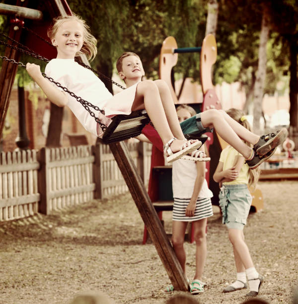 istock Girl sit in moving swing 1061742104