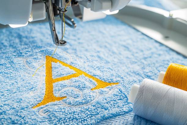 istock Embroidery machine and alphabet design on towel in hoop 1061743758