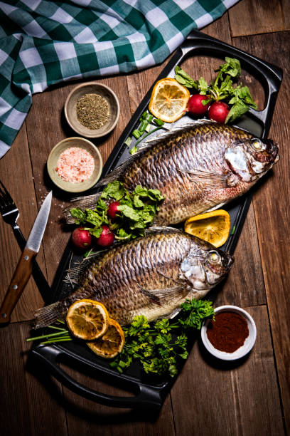 istock Gouremt Whole Dorado Fish on Metal Skillet Pan 1061745532