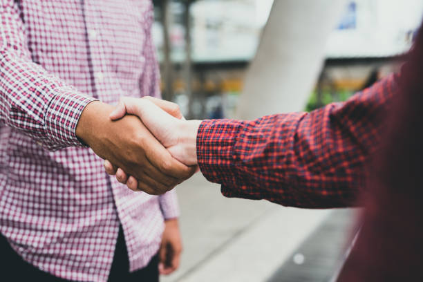 istock Business team greeting handshake. 1061746216