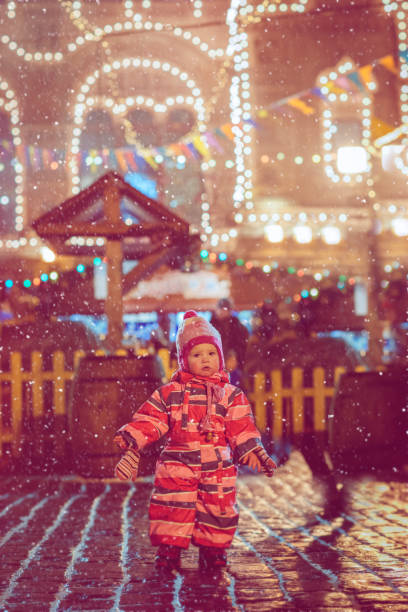 istock Child on Christmas time in the city 1061746706
