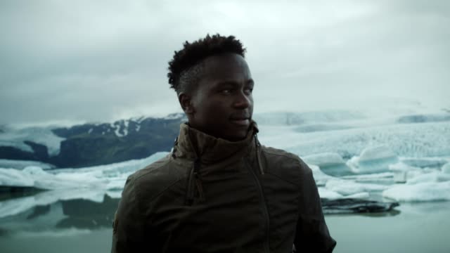 Traveler posing at glacier lagoon