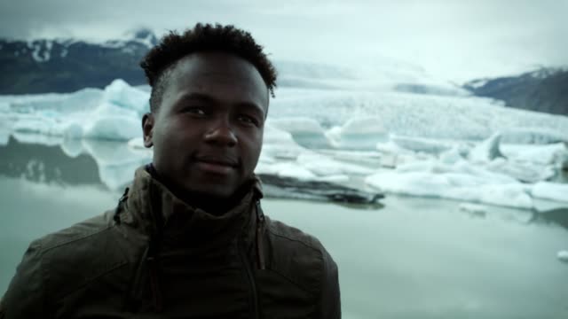 Traveler posing at glacier lagoon
