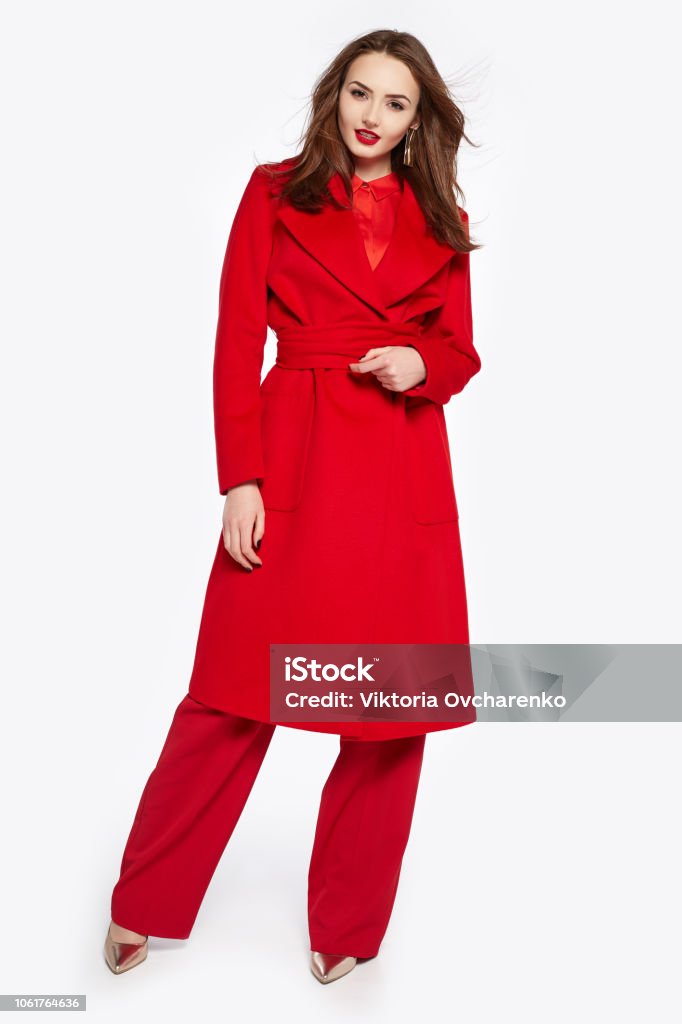 Elegant Lady In Red Coat And Pants Looking In Camera Brunette Young Woman With Long Hair Stylish Female Fashionable Red Outfit And Hairstyle Full Length Stock Photo - Download Image Now - iStock Elegant Lady In Red Coat And Pants Looking In Camera Brunette Young Woman With Long Hair Stylish Female Fashionable Red Outfit And Hairstyle Full Length Stock Photo - Download Image Now - iStock