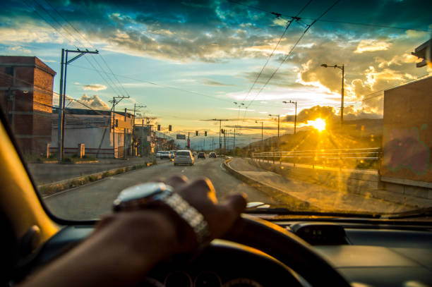istock driving at the sunset,View from the driver angle car. outside focus 1061765584