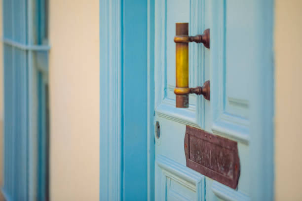Athens, Greece - June 26, 2019: Wall mailbox with magazine, journal inside of it. Postal service concept. Safety of personal data background. Advertising concept
