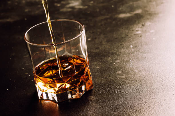 istock Whiskey Pour In Glass, Dark Background 1061769652