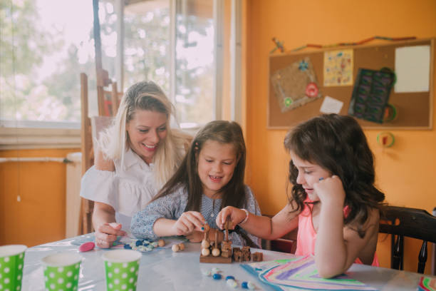 istock Girls making figurine at art class 1061770192