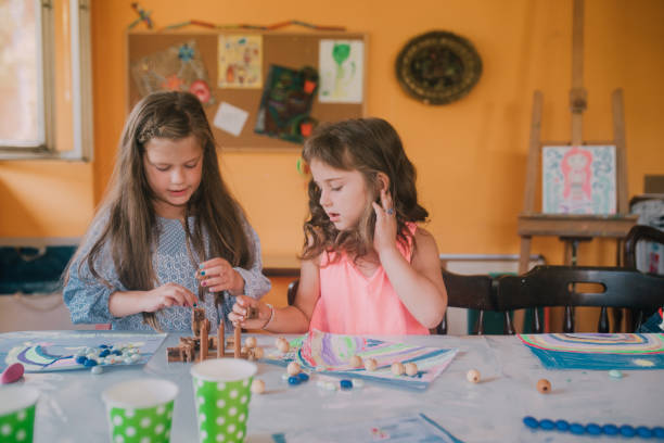 istock Young girls at art class 1061770216