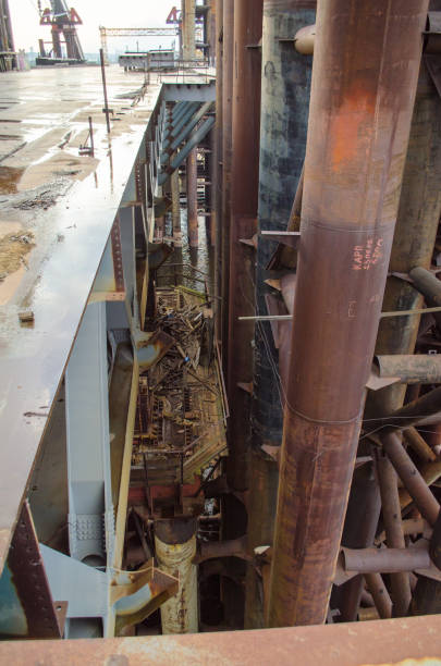 istock Unfinished bridge. Abandoned industrial rusty metal ruins. 1061772444