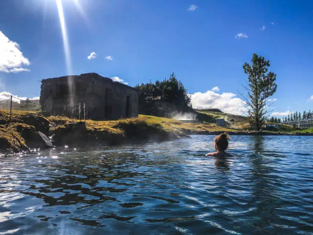 woman swimming in geothermal water