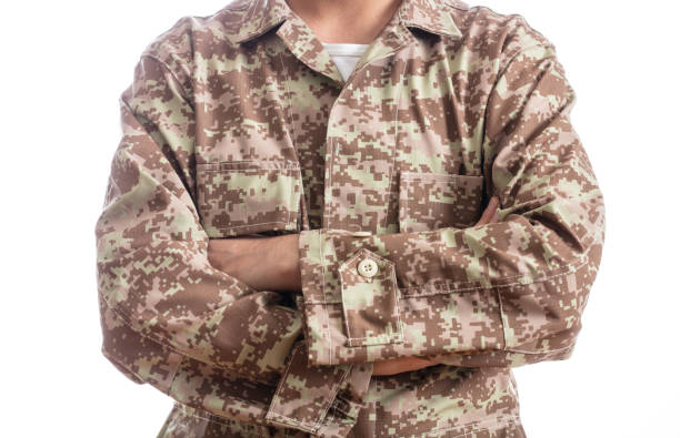 istock Young soldier with crossed arms isolated on white background 1061791470