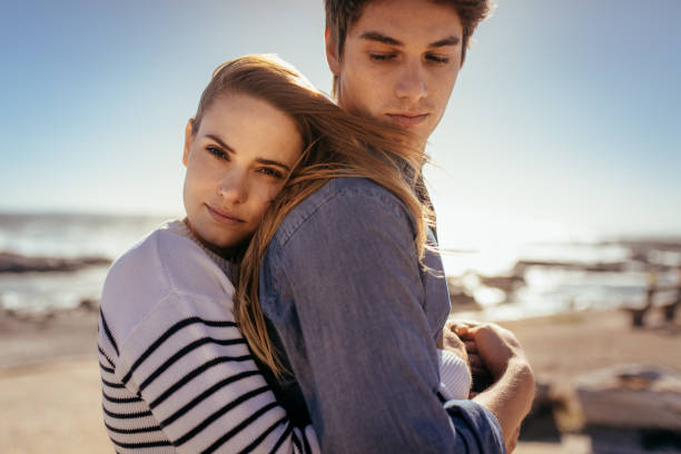 istock Couple standing together at a beach 1061792140