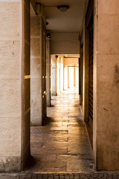 istock narrow alley with columns in Treviso, Italy 1061797178