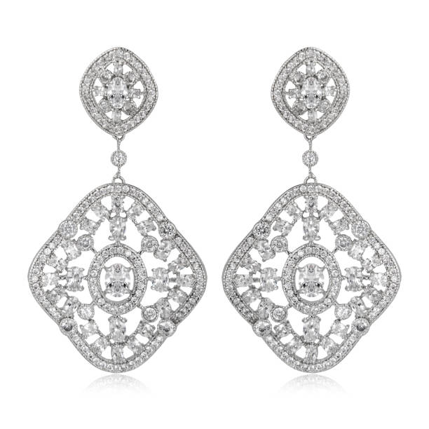 istock Pair of silver diamond earrings isolated on white background 1061797812