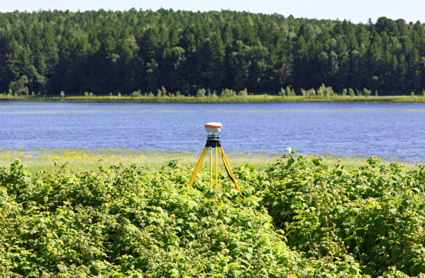 Geodetic GNSS receiver in the field in Siberia, mounted on a old tripod. Practical application for operation in networks of permanent base stations