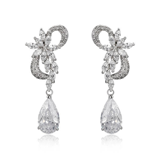 istock Pair of silver diamond earrings isolated on white background 1061800798