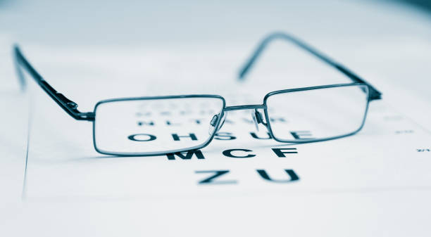 Clear Black modern glasses on a eye sight test chart.. stock photo