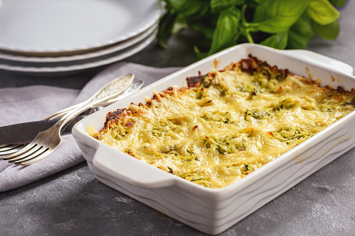 istock Zucchini and potatoe casserole with cheese,  vegetarian food. 1061815900