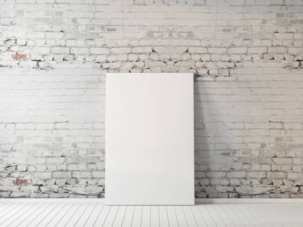 Poster mockup indoors on floor near brick wall