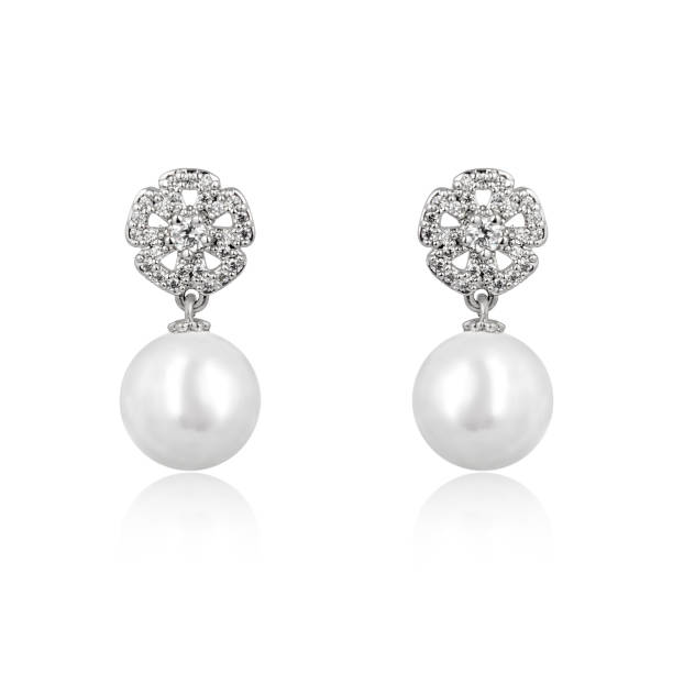 istock Pair of silver diamond earrings isolated on white background 1061827986