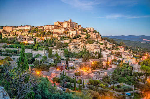 The town of Gordes, France at sunset. Gordes is a medieval town in Provence.
