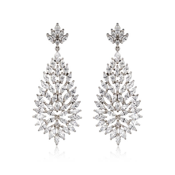 istock Pair of silver diamond earrings isolated on white background 1061831532