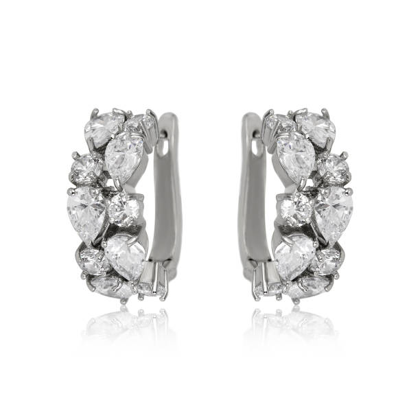 istock Pair of silver diamond earrings isolated on white background 1061831842