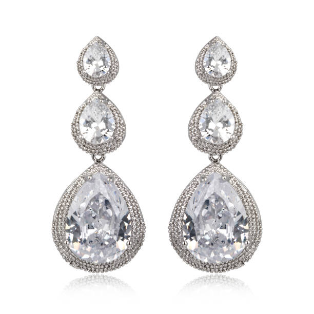 istock Pair of silver diamond earrings isolated on white background 1061832560