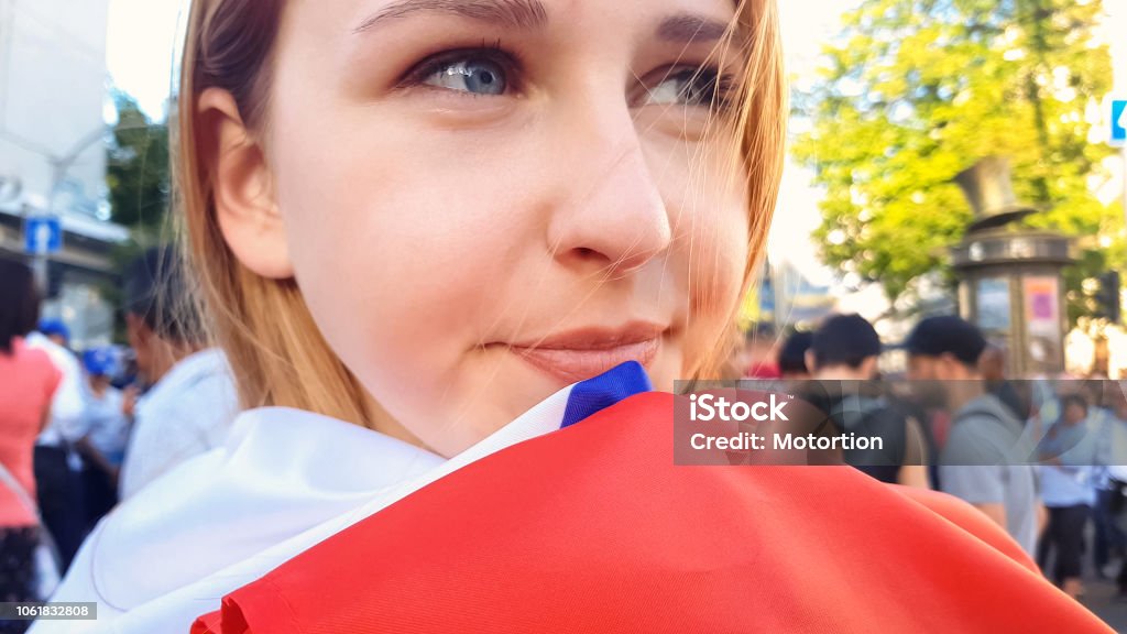 Beautiful young woman with national flag smiling, independence day celebration Fan - Enthusiast Stock Photo