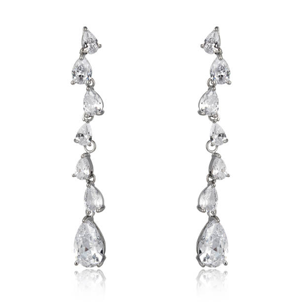 istock Pair of silver diamond earrings isolated on white background 1061835600