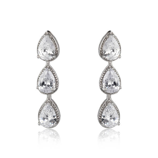 istock Pair of silver diamond earrings isolated on white background 1061837484
