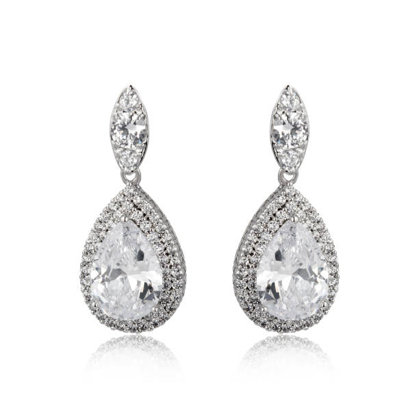 istock Pair of silver diamond earrings isolated on white background 1061837548