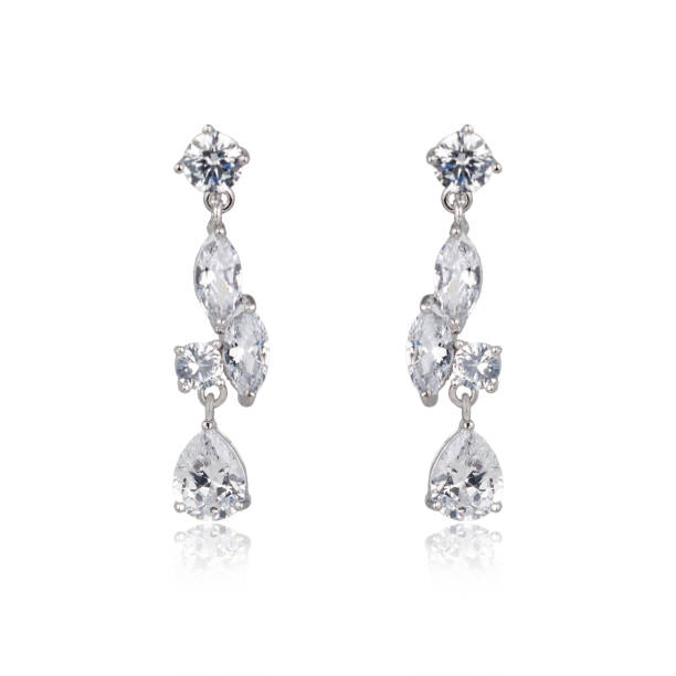 istock Pair of silver diamond earrings isolated on white background 1061837710