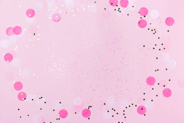 istock Pink confetti and stars and sparkles on pink background. 1061840824