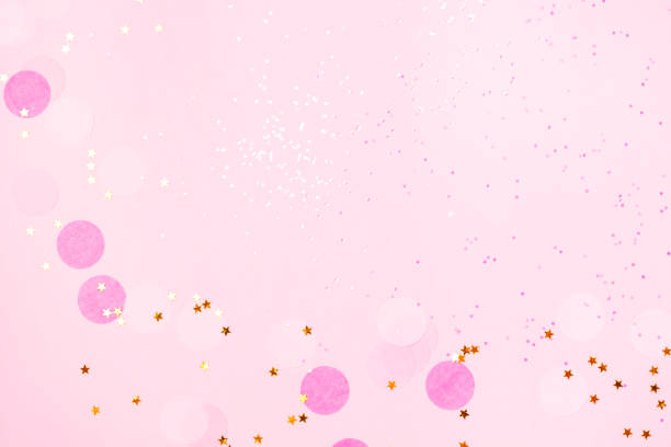 istock Pink confetti and stars and sparkles on pink background. 1061840830