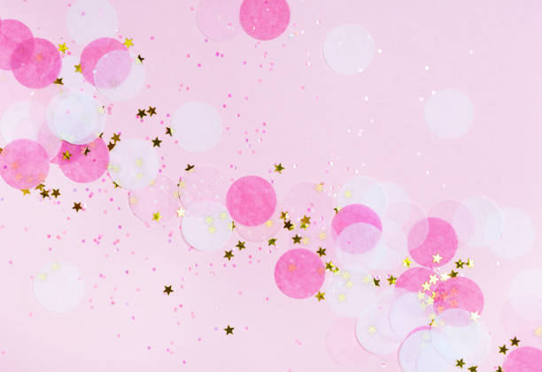 istock Pink confetti and stars and sparkles on pink background. 1061840850