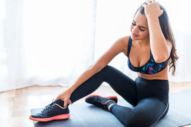 istock Woman get accident between workout in leg pain and hurt with wrong posture exercise 1061842264